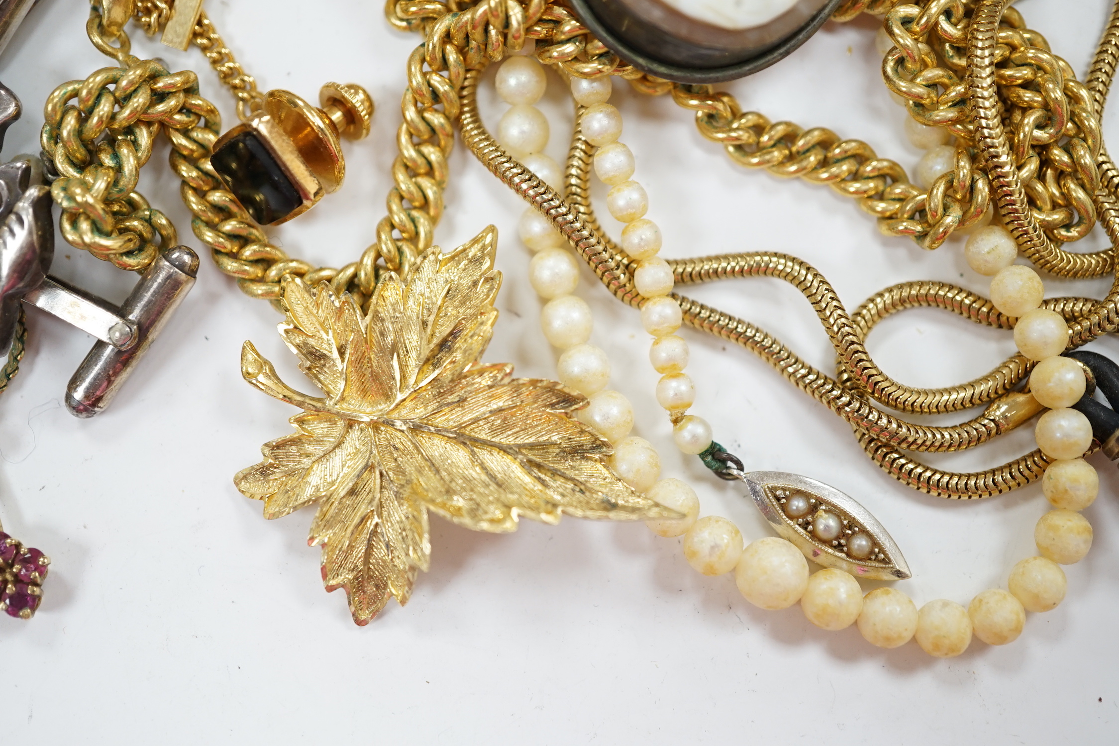 A small 9ct gold and gem set pendant, 22mm, three gilt metal chains, two white metal cufflinks, a Citizen watch, other costume jewellery and three ceramic items.